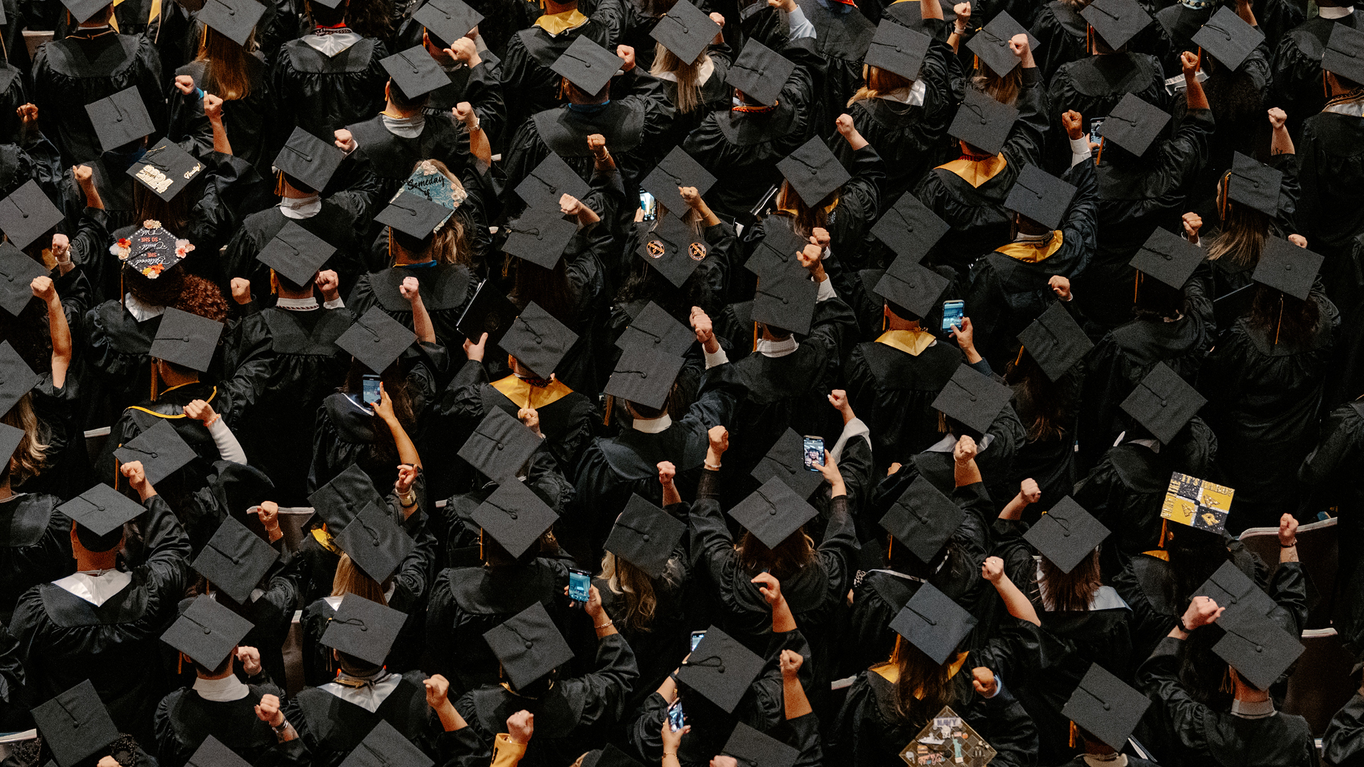 Group of graduates at an in-person Purdue Global ceremony.