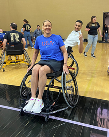 Julie Dussliere and Purdue basketball player Trey Kaufman-Renn participate in a Wheel RIISE event in 2024. 