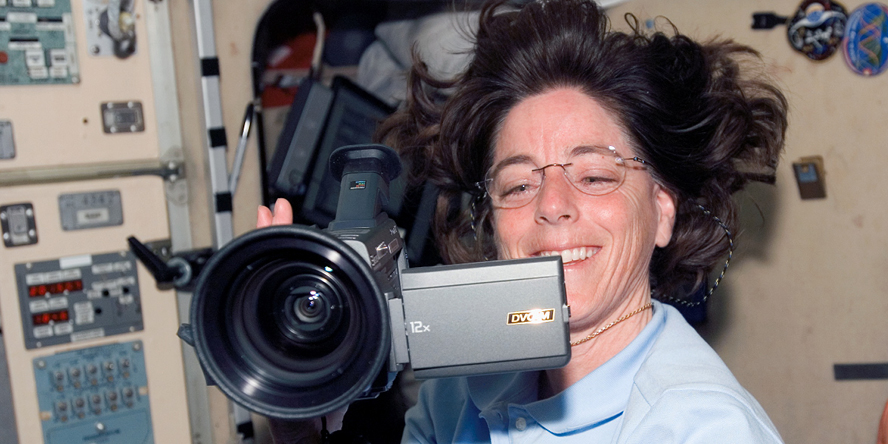 Barbara Morgan with a video camera.