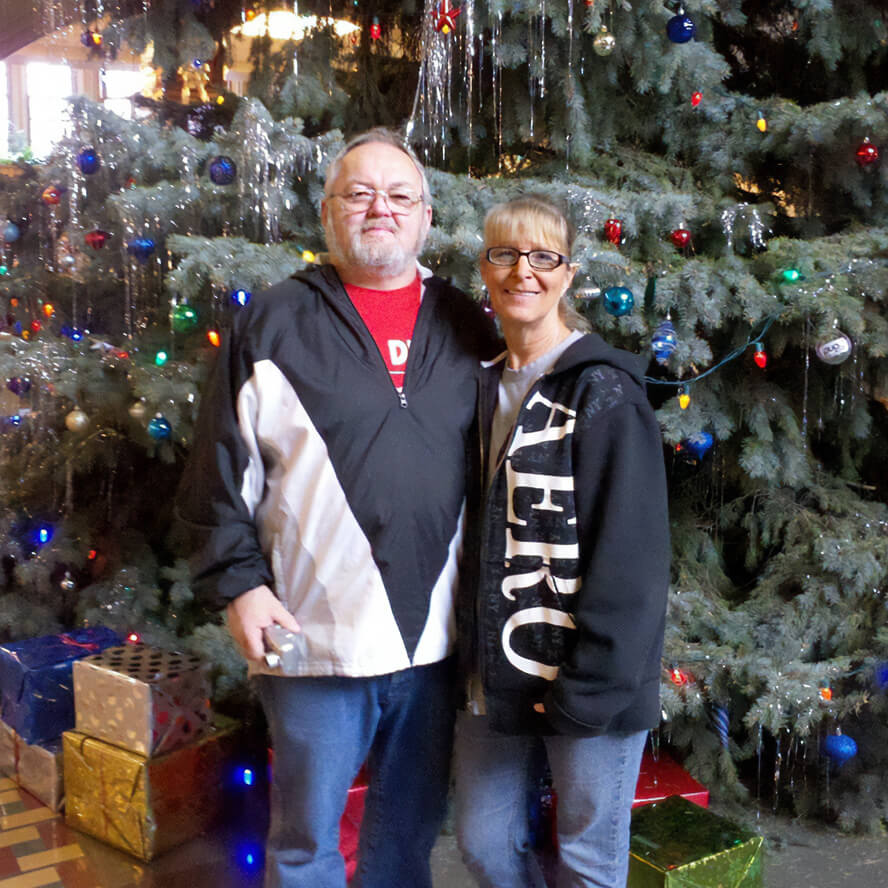 Darrell and Tina Smith pose for a photo at the Purdue Memorial Union Christmas tree.