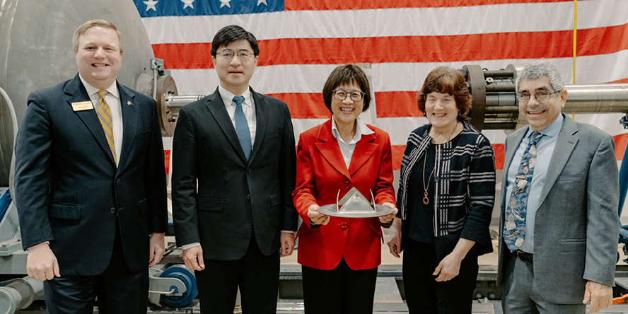 Mung Chiang with officials from Rolls-Royce.