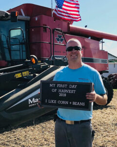 Greg Etter with farm equipment.