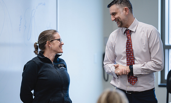 Purdue nursing professor Rebecca Johnson stands in her classroom while receiving a teaching award.