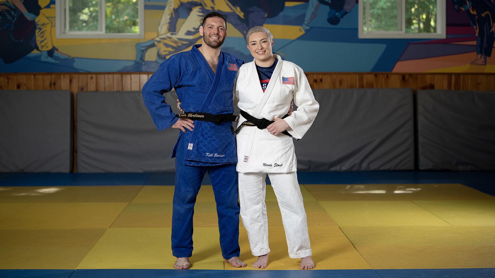 At their gym in New York, Kell and Nicole pose together on the mat. 