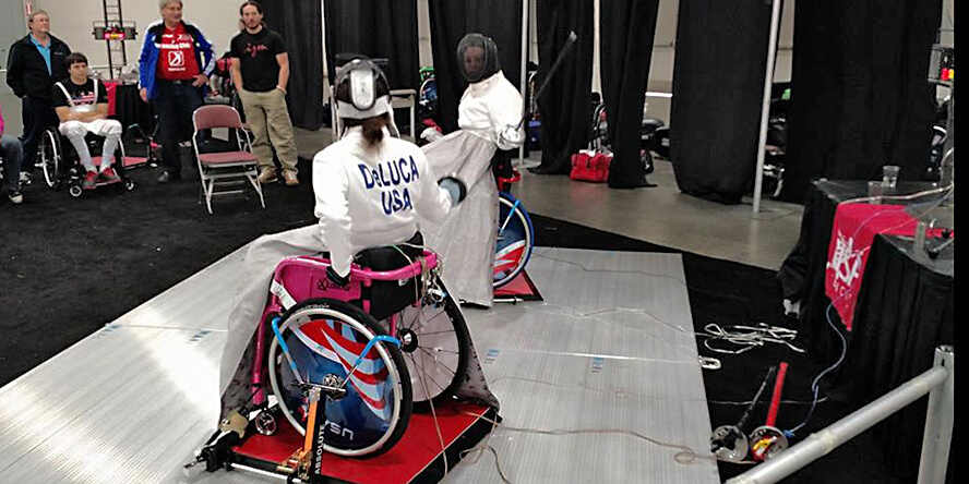 DeLuca is engaged in a bout with an opponent.