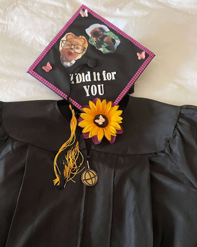 Shields’ cap and gown from Purdue Global graduation. The cap reads, “I did it for you,” and includes two photos of her son.