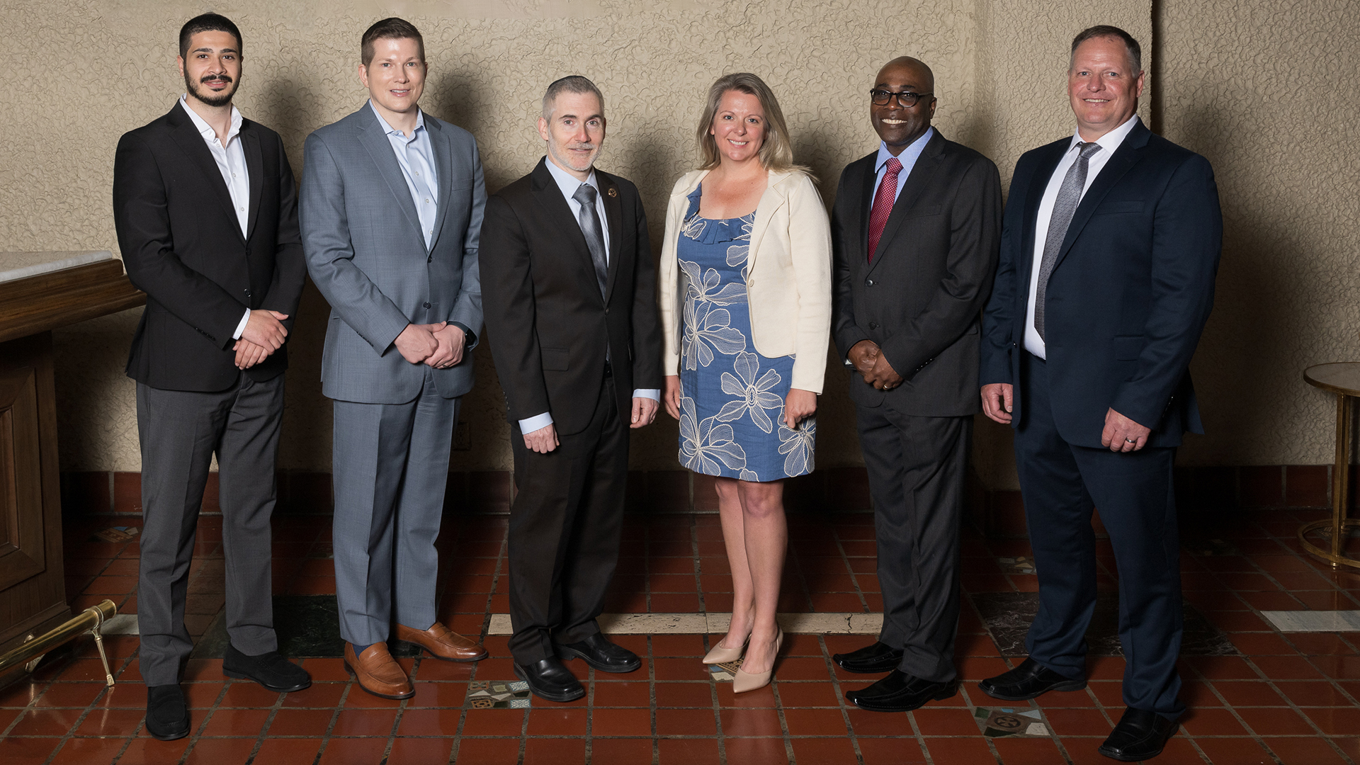 Purdue Global Law School graduates standing for a picture with Dean Martin Pritikin.
