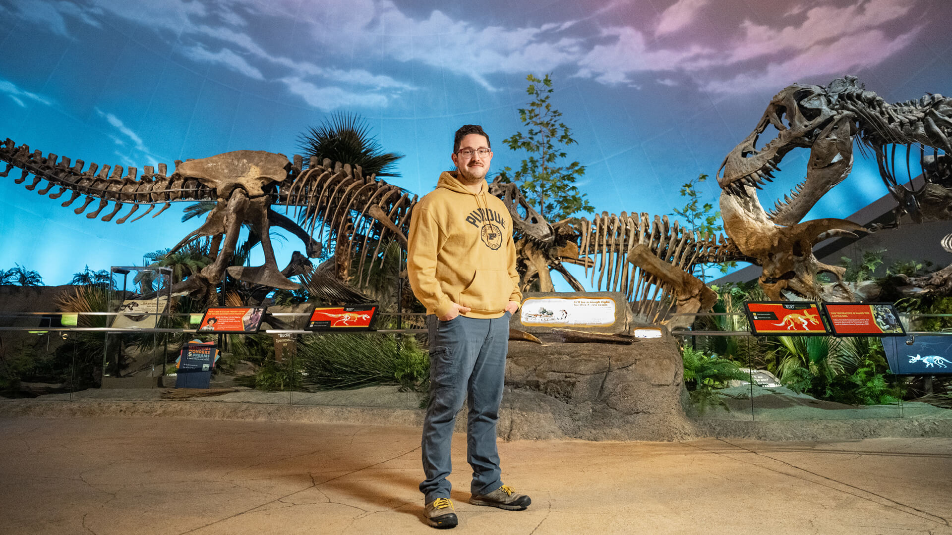 Jonathan Bailey standing in the Dinosphere® exhibit.