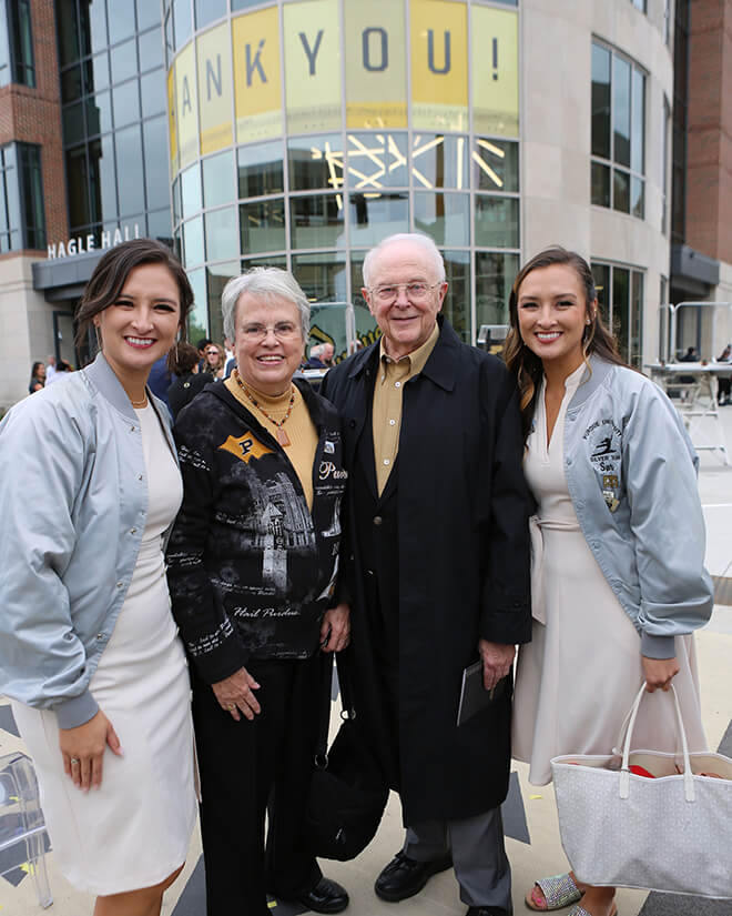 Sara and Chellie Zou with their grandparents.