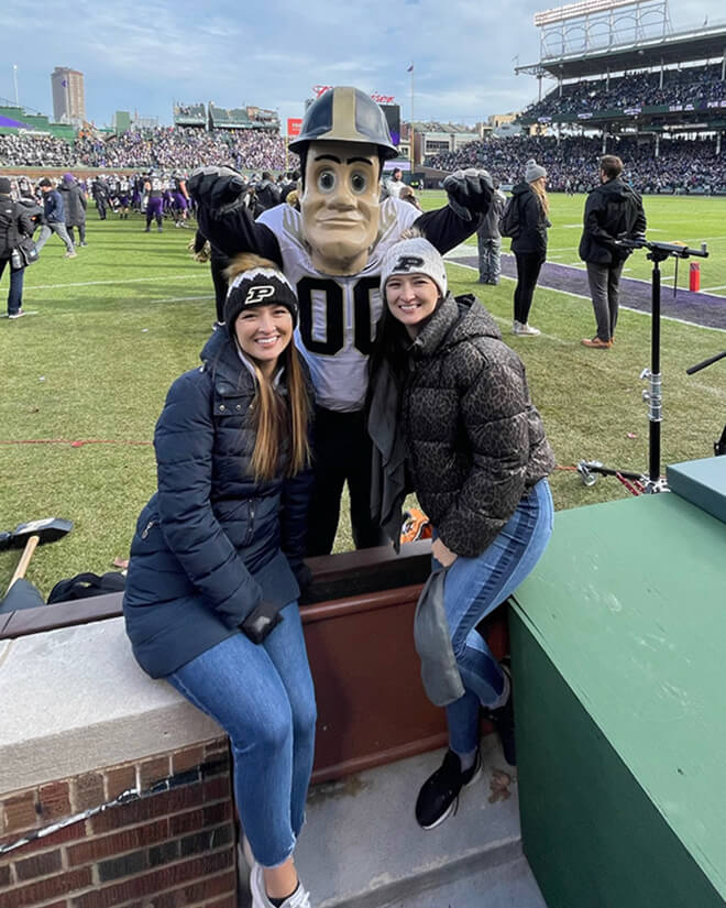 Sara and Chellie Zou as alumni with Purdue Pete.