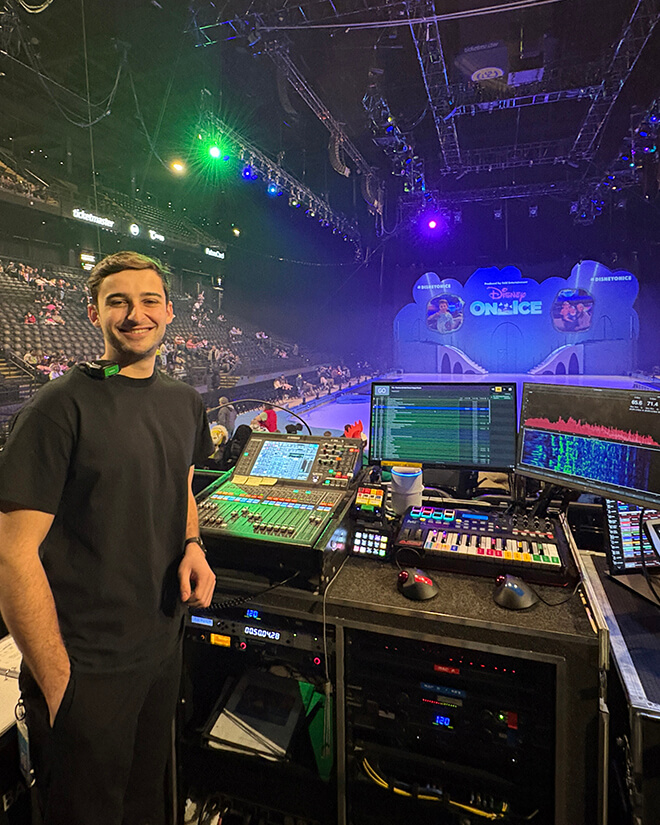 Robert Cohen standing in front of a technical board.
