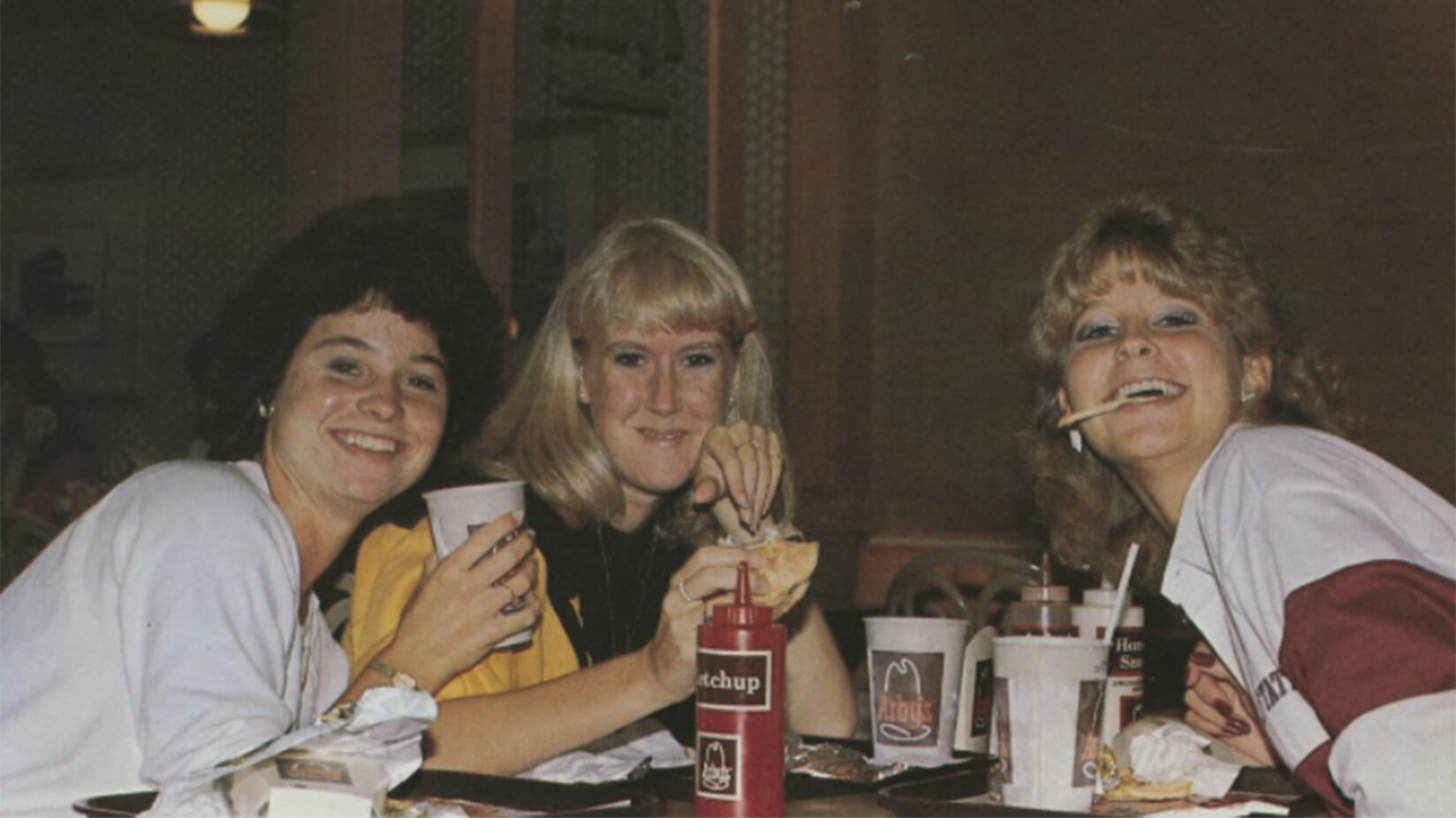 Three 1980s-era Purdue students eat fast food
