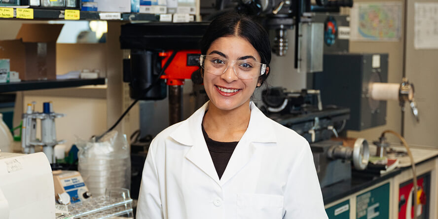 Janvi Prasad poses in lab gear at professor Anasori’s Indianapolis lab.