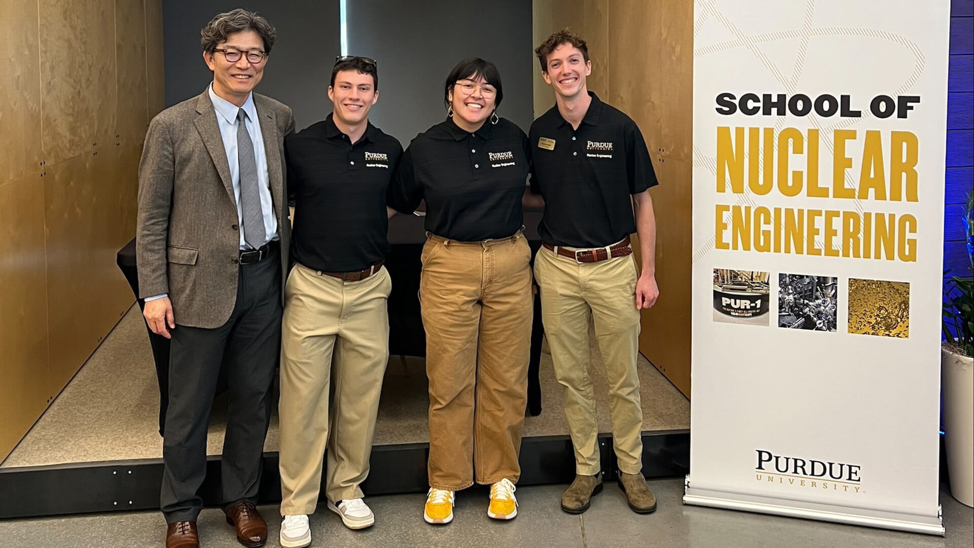Purdue nuclear engineering head Seungjin Kim poses for a photo with students Ryan Hogg, Grace O’Neil and Preston Kilzer