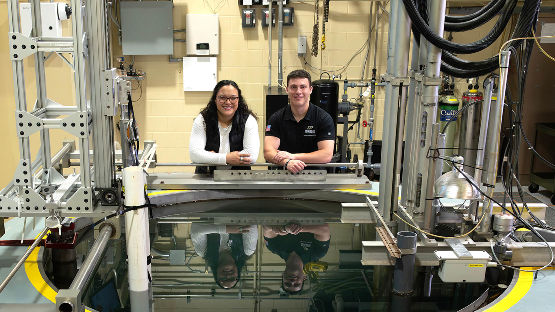 Purdue graduate students Hannah Pike and Ryan Hogg at the PUR-1 nuclear reactor