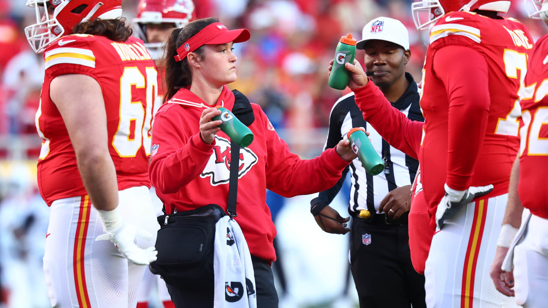 Gabby Poalino works during an NFL game as an athletic trainer with the Kansas City Chiefs