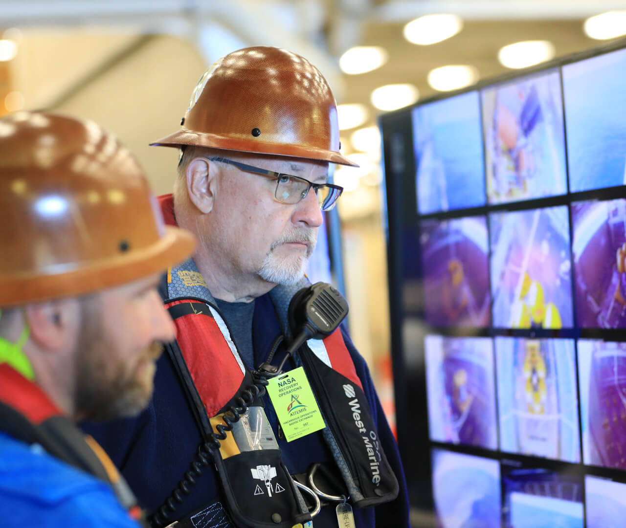 Purdue alum and NASA engineer Rob Lantz watches a bank of video screens