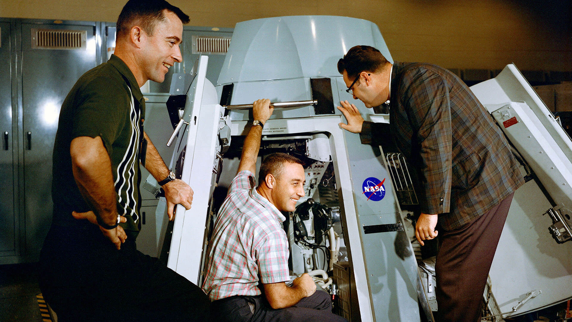 John Young and Gus Grissom inspect the Gemini 3 capsule