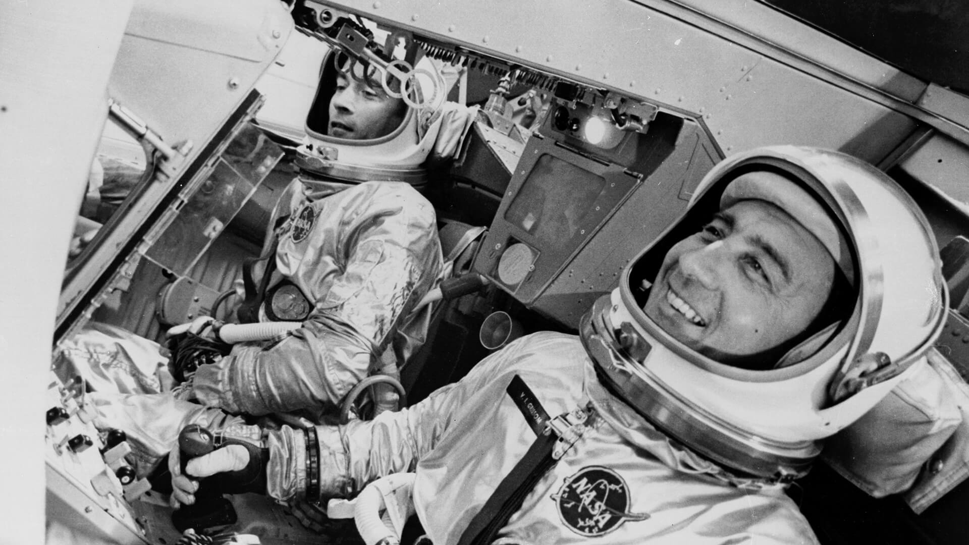 Astronauts John Young and Gus Grissom practice in the Gemini 3 spacecraft simulator
