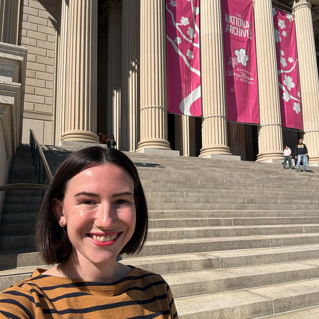 Caroline Shanley poses for a selfie on the steps of the National Archives Building in Washington, D.C.