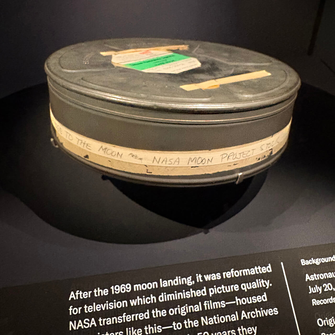 A film canister featuring footage from the Apollo 11 mission