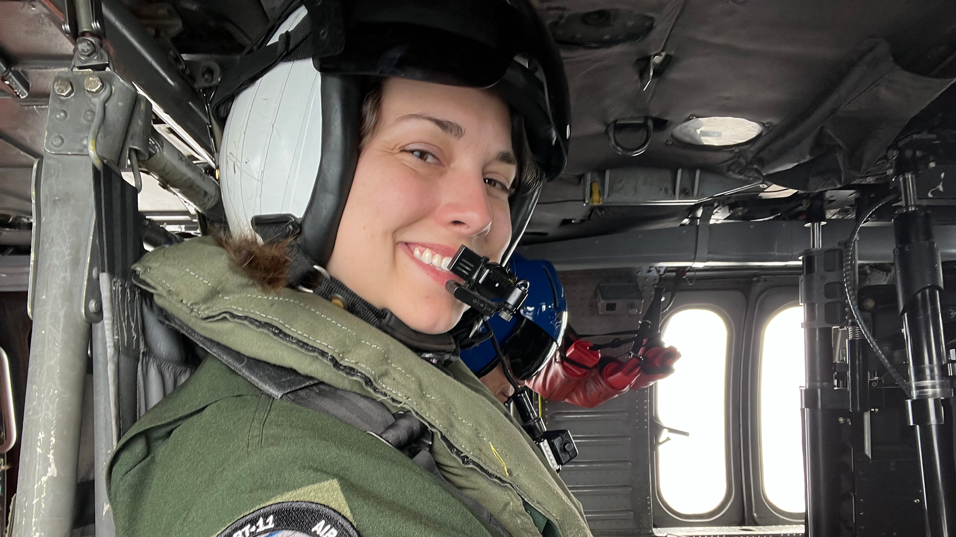 Emily Spreen riding in a helicopter.