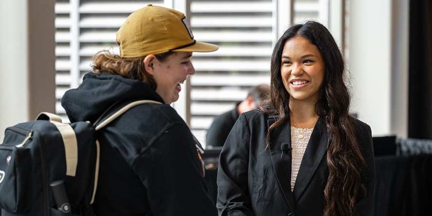 Abigail Mizzi chats with a fellow Purdue student