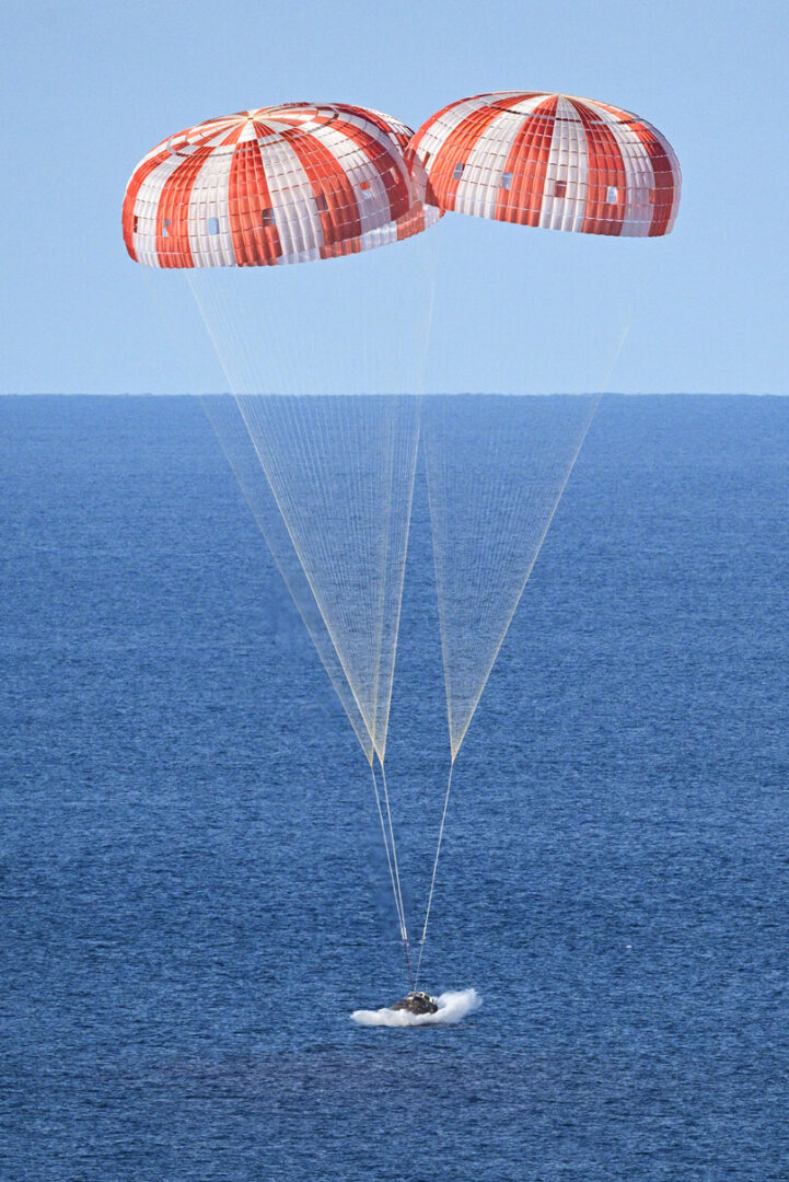 Parachutes set the Orion capsule down safely in the Pacific Ocean after its trip to the moon during the Artemis II mission 