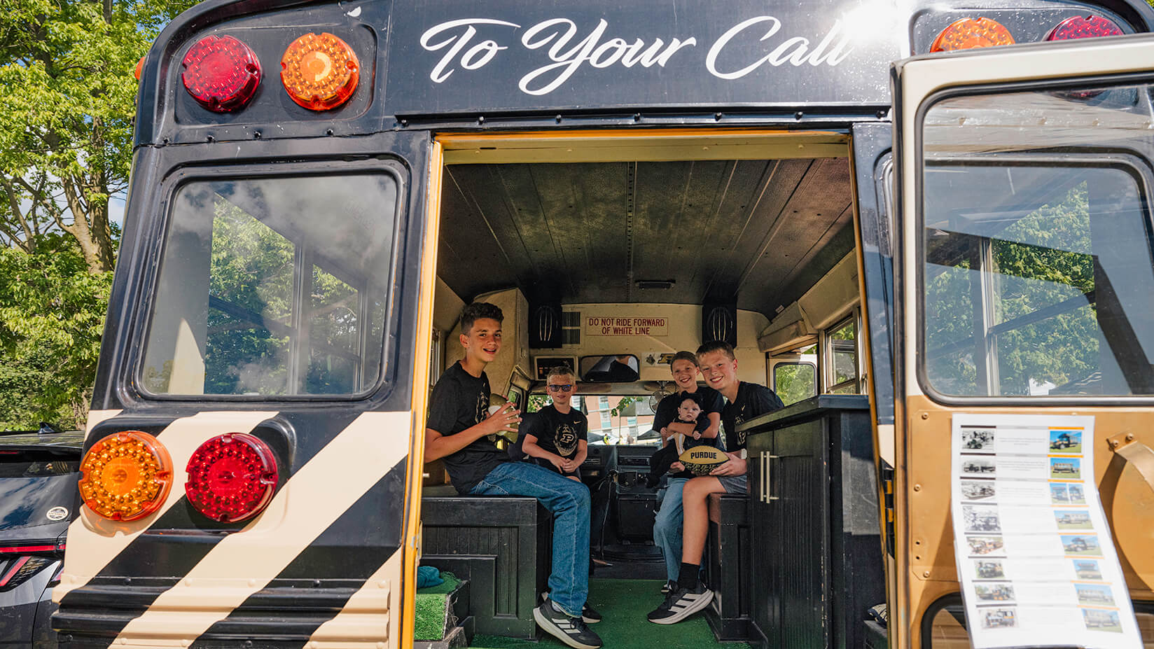 Members of the Vandewalle family sitting inside the bus.