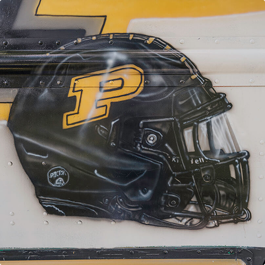 A Purdue football helmet painted the driver side.