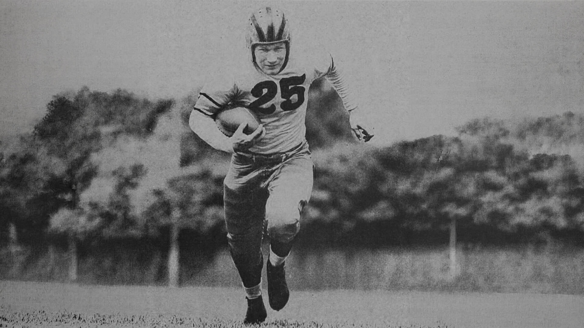 Tony Butkovich carries the ball in a 1943 team photo.