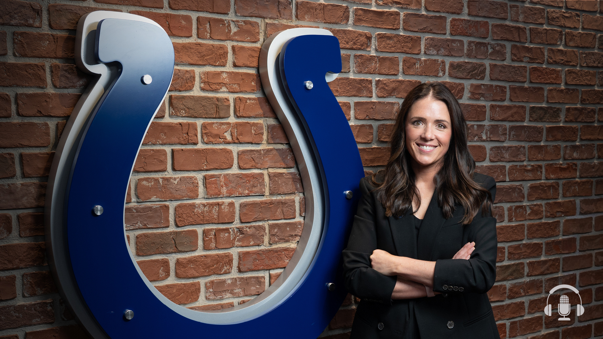 Stephanie Pemberton in front of Colts logo
